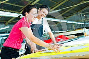 Worker and Dressmaker in a factory