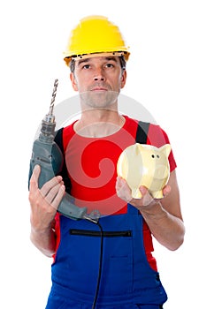 Worker with drill and piggy bank