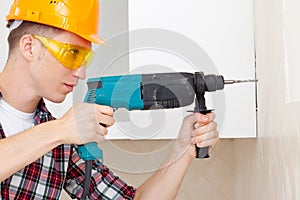 Worker with drill