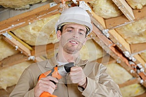 Worker after drilling roof