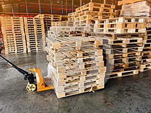 Worker driving forklift to loading and unloading wooden pallets from truck to warehouse cargo storage, shipment in logistics and t