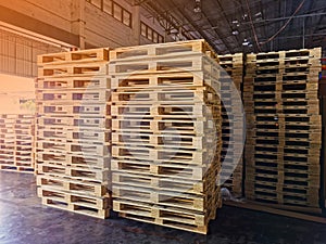 Worker driving forklift to loading wooden pallets from truck to warehouse cargo storage, shipment in logistics and transportation