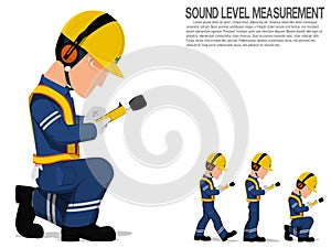 A worker with earmuff is operating sound level measuring equipment