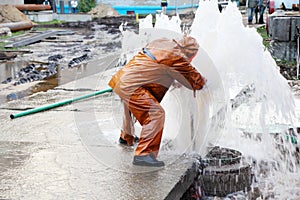 Worker eliminates breakthrough of sewerage systems.