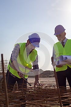 Worker and engineer at building site
