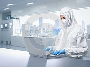 Worker or engineer wears protective suit or coverall suit work in semiconductor manufacturing factory