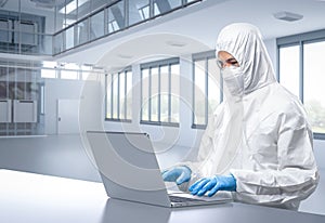 Worker or engineer wears protective suit work in semiconductor manufacturing factory