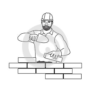 Worker erecting a brick wall, muscular man building a house