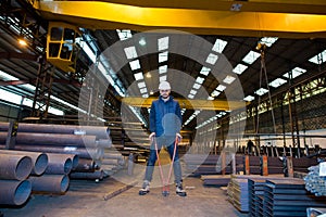 Worker in factory in stockroom