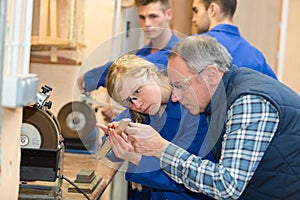 Worker female ready to use circular saw