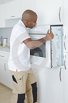 Worker fitting oven