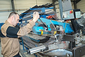 worker fixing a machine