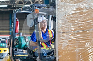 Worker on forklift, Manual workers working in warehouse, Worker driver at warehouse forklift loader works