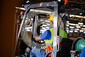 Worker on forklift, Manual workers working in warehouse, Worker driver at warehouse forklift loader works