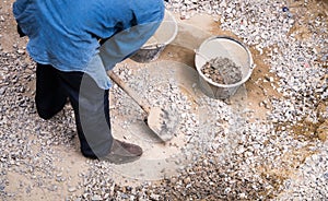 Worker gathering stone