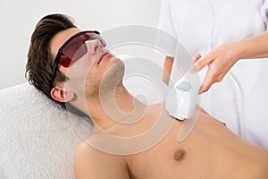 Worker Giving Man Laser Epilation