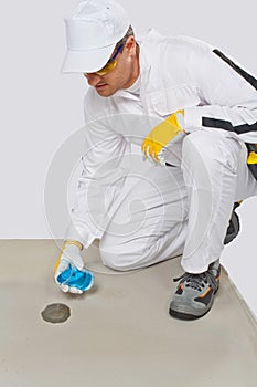 Worker glass flask of water