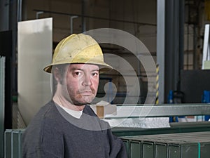 Worker in glass warehouse