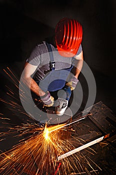 Worker with grinder photo