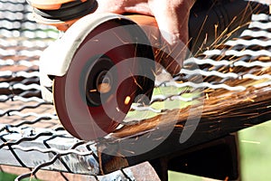 Worker grinding a metal part