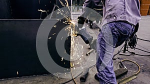 Worker are grinding metal steel