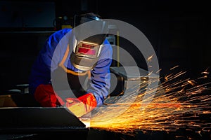Worker grinding/welding