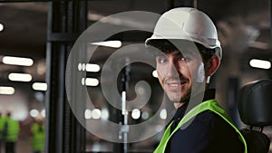 Worker Guy in Special Uniform Standing in Warehouse. People Portrait