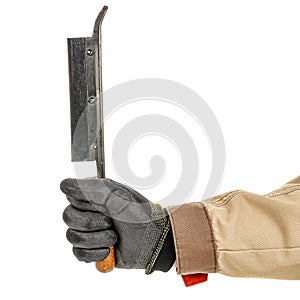 Worker hand in black protective glove and brown uniform holds vintage carpenter hacksaw close-up isolated on white background