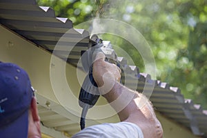 worker hand man holding broken grinder blade. Danger of using power tools. Close-up