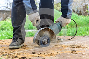 Worker hands cutting a metal sheet