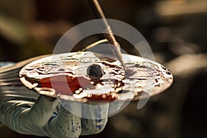 Worker hands while mixture colors 2 photo