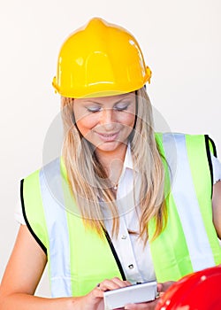 Worker with hard hat looking at drawing