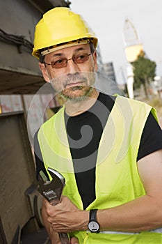 Worker with hard hat and wrench