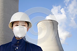 Worker with hardhat and mask at power plant