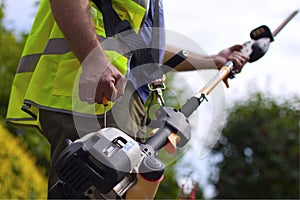 Worker with hedge trimmer