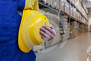 Worker in high bay warehouse