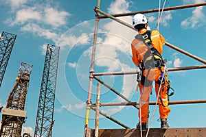 Worker on high on scaffolding photo