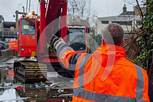 worker with a highvis jacket signaling crane mishap