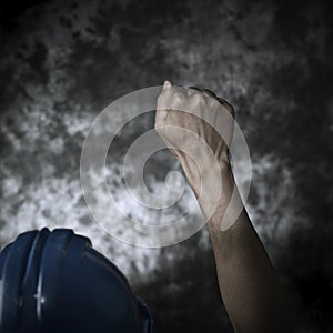 Worker with his fist raised to the air