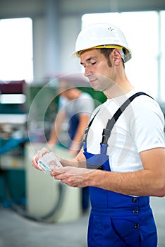 Worker with his wages