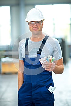 Worker with his wages