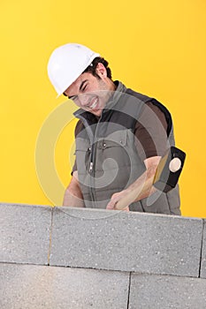 Worker hitting a wall