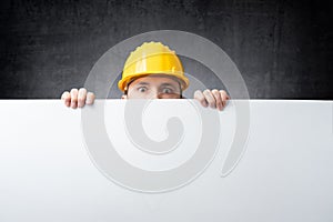 Worker holding blank board