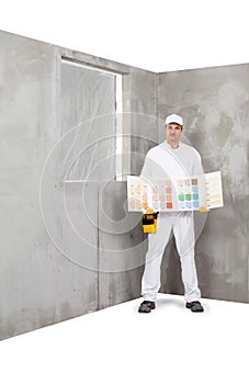 Worker holding a colour samples palette