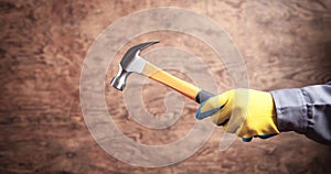 Worker holding hammer. Construction tool