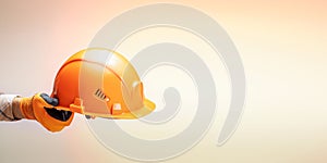 worker holding helmet close up. banner with copy space
