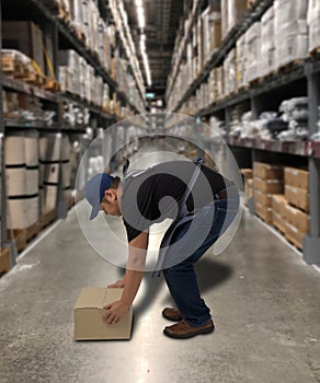 Worker holding parcel boxes