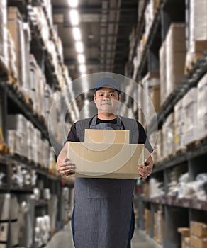 Worker holding parcel boxes