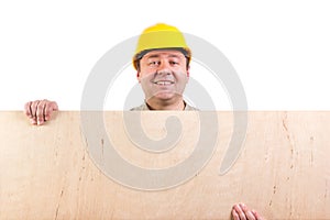 Worker holding a plywood