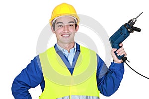 Worker holding a power tool